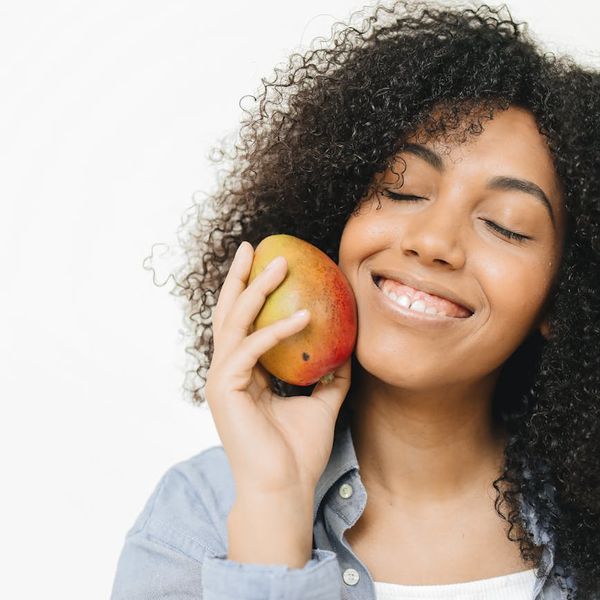 A person looking serene and happy, embodying a state of well-being.